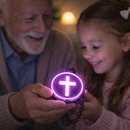 Grandfather and granddaughter holding a glowing purple device with a led cross protection pendant symbol.